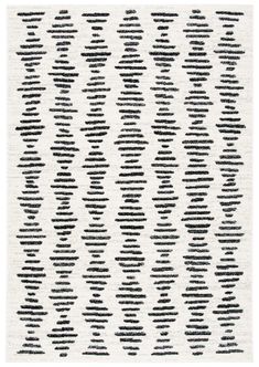 a black and white rug with wavy lines on it