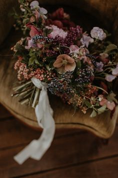 a bouquet of flowers sitting on top of a chair