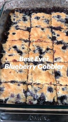 a glass baking dish filled with blueberry bars