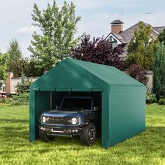 a truck is parked in a green garage with its door open and the roof opened