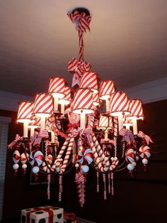 a chandelier with candy canes hanging from it