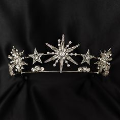 Angelica's tiara features star designs that remind me of a shooting star. Great for an ice princess or a rising (or shooting) star, Angelica sparkles and shines like the night sky or twinkling falling snow flakes.  Max Height At Center: 2.1 inches Total Length End to End: 15.5 Inches Total Length of Embellishment: 11.5 Inches Head Opening is Adjustable  WARNING: CHOKING HAZARD This item is not intended for use by children under the age of 5 years old.  There are small pieces that could fall off Halo Tiara, Star Tiara, Celestial Wedding Theme, Starry Wedding, Starry Night Wedding, Star Crystal, Moon Wedding, Bride Tiara, Celestial Wedding