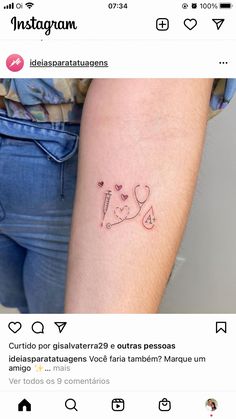 a woman's arm with a small tattoo on it