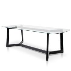 a glass table with black metal legs