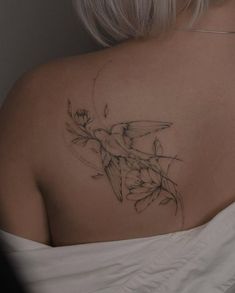 a woman with a tattoo on her back