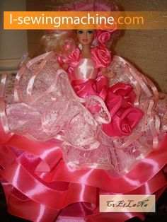 a barbie doll in a pink dress with roses on it