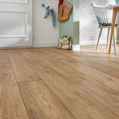 a wooden floor in a room with white walls