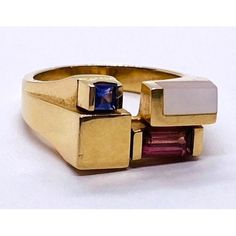 Kabana 14k Gold Ring Set With Mop, 2 Color Stones Condition: Used Material: 14k Yellow Gold Ring Size: 6 Weight: 6.4 Grams Top Width: 9mm Bottom Width: 3mm Stone Info: Set With Mother Of Pearl Inlay, 6mm X 3mm Baguette Cut Pink Stone And A ,2.5mm Square Stone. Its Hard To Make The Color Of It It Looks Purple From One Angle And Blue From Another Modern 14k Gold Multi-stone Jewelry, Modern Gold Multi-stone Jewelry, Yellow Gold Multi-stone Art Deco Jewelry, Art Deco Multi-stone Yellow Gold Jewelry, Art Deco Yellow Gold Multi-stone Jewelry, Modern 14k Gold Pink Jewelry, Modern Gold Multi-stone Sapphire Ring, Modern Gold Sapphire Ring With Multi-stone, Modern 14k Yellow Gold Sapphire Ring