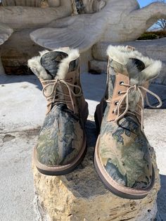 Whether you're going out for lunch or enjoying a Saturday at home, our Ganali Boot is the perfect choice! The Hunter Camo will blend with everything and have you stand out at the the same time. *These boots run small. Please order a size up. *Made of premium, sustainable sheepskin *Rubber outersole *Ankle length style *Pull-on style *Lace ties *There may be differences in color due to variances in lighting or monitor display Military Style Combat Boots For Winter Outdoors, Camo Winter Boots, Military Combat Boots For Outdoor Winter Use, Military Leather Boots For Winter, Khaki Military Boots With Round Toe, Red Fur, Sheepskin Boots, Black Boots Women, Bear Paws