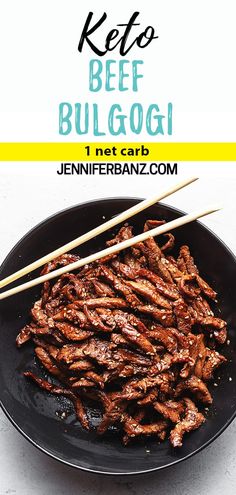 a black plate topped with meat and chopsticks next to the words keto beef bulgogi