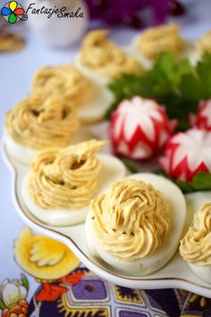 deviled eggs with peanut butter frosting on a plate