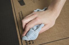 a person is cleaning the floor with a cloth