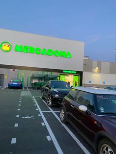 cars are parked in front of the store