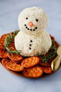 a snowman made out of rice on top of crackers