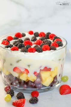 a fruit trifle is shown in a glass dish