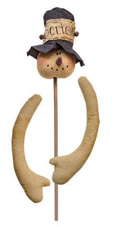 a wooden stick with a hat on top of it