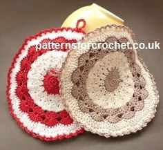 two crocheted coasters sitting next to each other