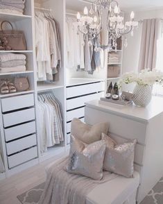 an instagramted photo of a woman's walk - in closet with flowers