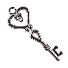 a silver key with a heart on it