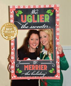 two women are holding up a holiday photo frame that says uglyler the sweaters