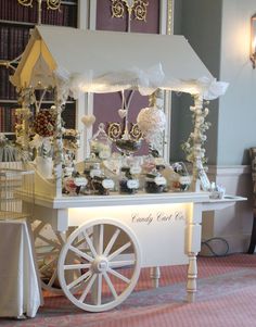 an image of a candy cart in the middle of a room with decorations on it