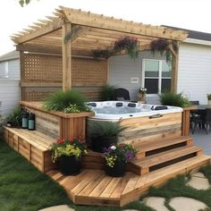 a hot tub sitting on top of a wooden deck next to a patio with potted plants