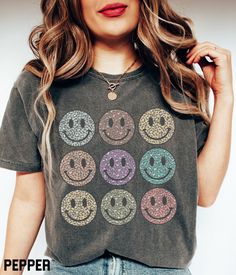 Cute smiley face graphic tee. This oversized t-shirt is available in a variety of colors and features a rainbow leopard happy face grid design. You'll love the comfortable material of the Comfort Colors fabric. It ensures a soft and comfortable feel that will keep you feeling good all day long. This unisex trendy and aesthetic graphic tshirt will have you standing out from the crowd. Smiley Face Shirt Comfort Colors Retro Dont Worry Be Happy Face Graphic Tee, Cute Oversized Leopard Smile Face Ts Dont Worry Be Happy, Smiley Face Graphic, Smiley Face Tshirt, Smiley Face Shirt, Cute Smiley Face, Country Sweatshirts, Face Graphic, Country Music Shirts, Rainbow Leopard