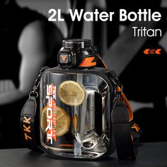 a water bottle with two lemon slices in it and an orange strap around the bottom