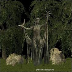 a statue is standing in the grass near some trees