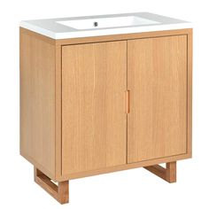 a wooden cabinet with a white sink in it