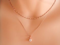 rose gold diamond necklace April birthstone necklace solitaire necklace diamond choker tiny diamond necklace delicate tiny CZ necklace Sterling silver 925 or gold vermeil (gold over sterling silver 925) delicate chain runs through a small sterling silver rhodium plated 925 or gold vermeil pendant. The pendant has in the middle a beautiful small sparkilng cz. The gold vermeil pendant can be yellow or rose gold. You can layer this cz pendant necklace with chain necklaces or charm necklaces! A beau Minimalist Cubic Zirconia Jewelry With Diamond Cut, Minimalist Diamond Jewelry Tarnish Resistant, Fine Jewelry Cubic Zirconia Charm Necklace With Adjustable Chain, Fine Jewelry With Delicate Chain And Round Pendant, Double Strand Fine Jewelry For Wedding, Delicate Adjustable Pendant Jewelry, Delicate Tarnish Resistant Round Pendant Jewelry, Delicate Tarnish-resistant Round Pendant Jewelry, Dazzling Diamond Cut Jewelry Gift