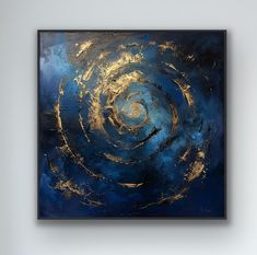 an abstract painting with gold and blue colors