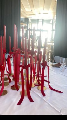 red ribbons and wine glasses on a table