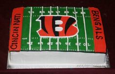 a football field cake is decorated with the logo of the cincinnati bears on it's side