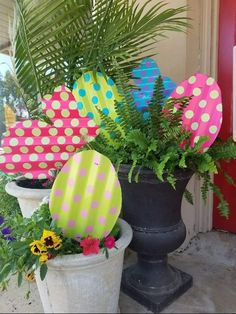 some potted plants are decorated with polka dots