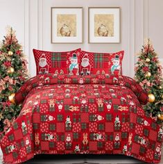 a christmas themed bed set with santa and reindeers on the red bedspread