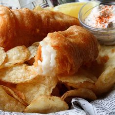 a basket filled with fried food on top of a table