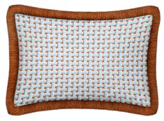 a blue and brown pillow with an orange border on the bottom, in front of a white background