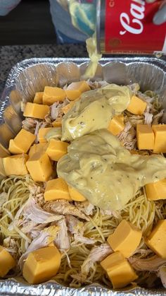 a metal pan filled with pasta and cheese