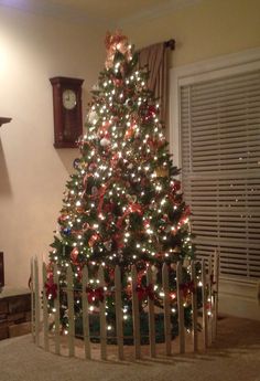 a christmas tree is lit up in the living room