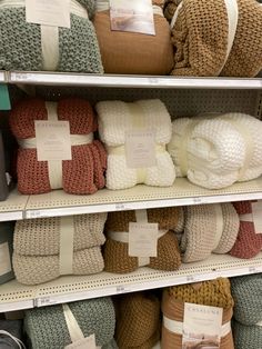 towels and blankets are on display in a store