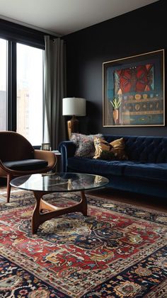 a living room filled with furniture and a large painting on the wall above it's glass coffee table