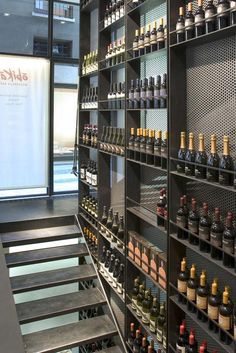 the shelves are filled with many different types of bottles