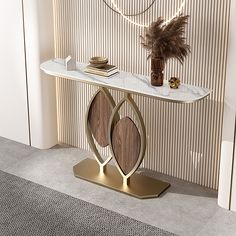 a console table with marble top and gold accents in front of a wallpapered background