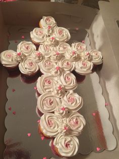 cupcakes are arranged in the shape of a cross