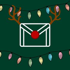 an envelope with christmas lights on it and a red ball in the middle is surrounded by reindeer antlers