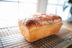 a loaf of bread sitting on top of a cooling rack