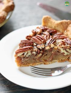 a slice of pecan pie on a plate with a fork