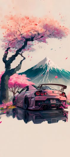 a car is parked under a tree with pink flowers on it and mountains in the background