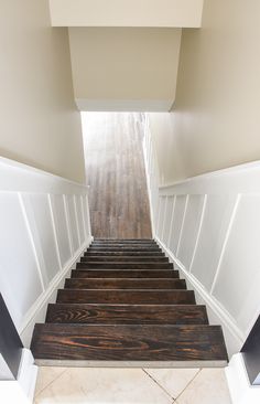 the stairs are made of wood and white paint